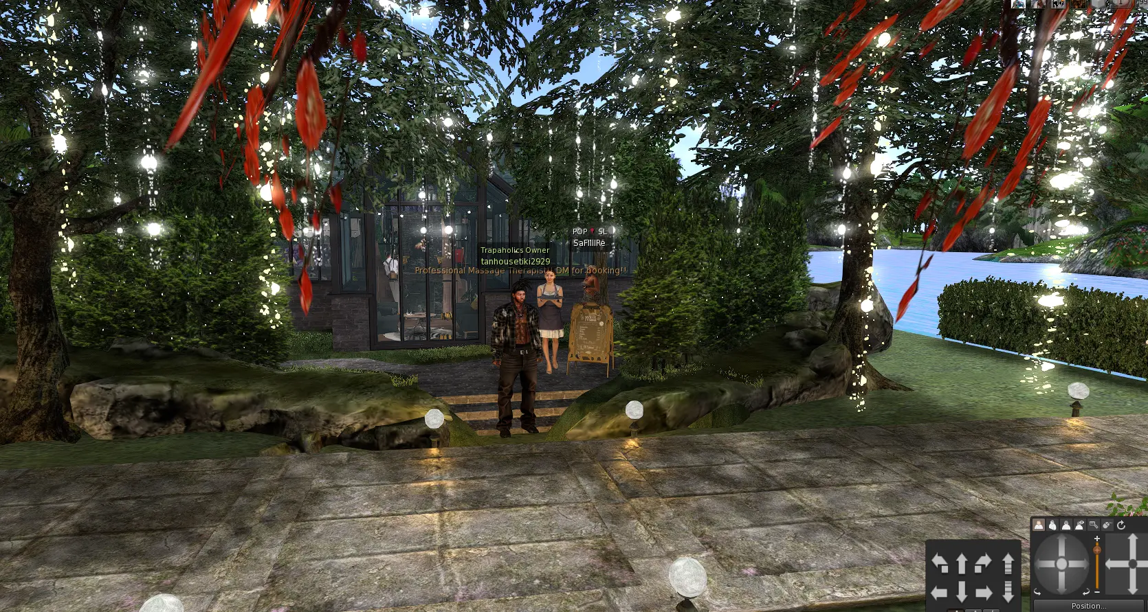 Wide front view of the restaurant with trees, lights and landscaping